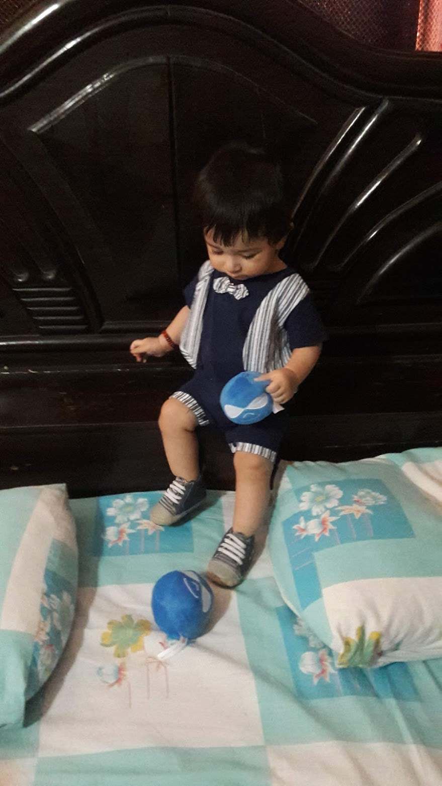 My baby playing with the logos his father loves